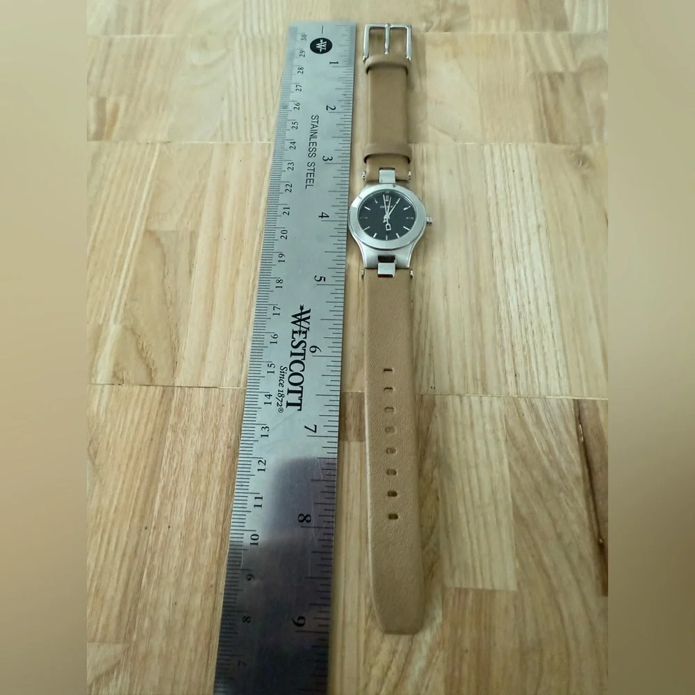 DKNY ladies silver tone tan leather dress watch NEW BATTERY